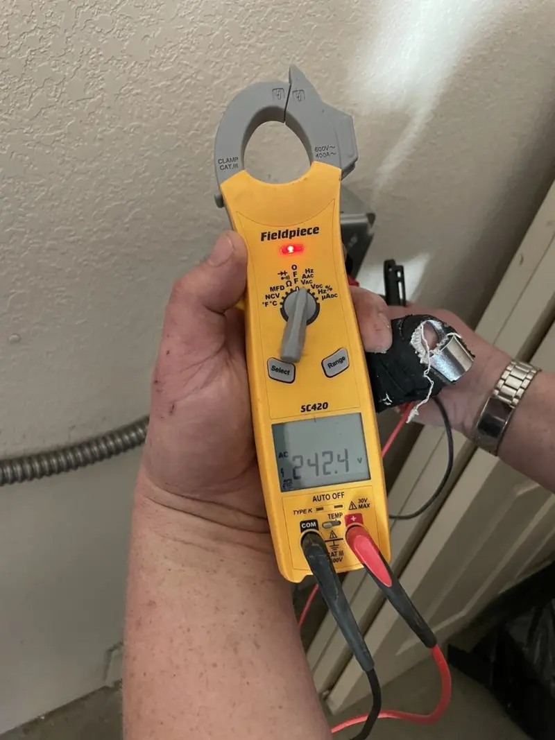Voltage testing with clamp meter during Electrical Installation Services in Saginaw